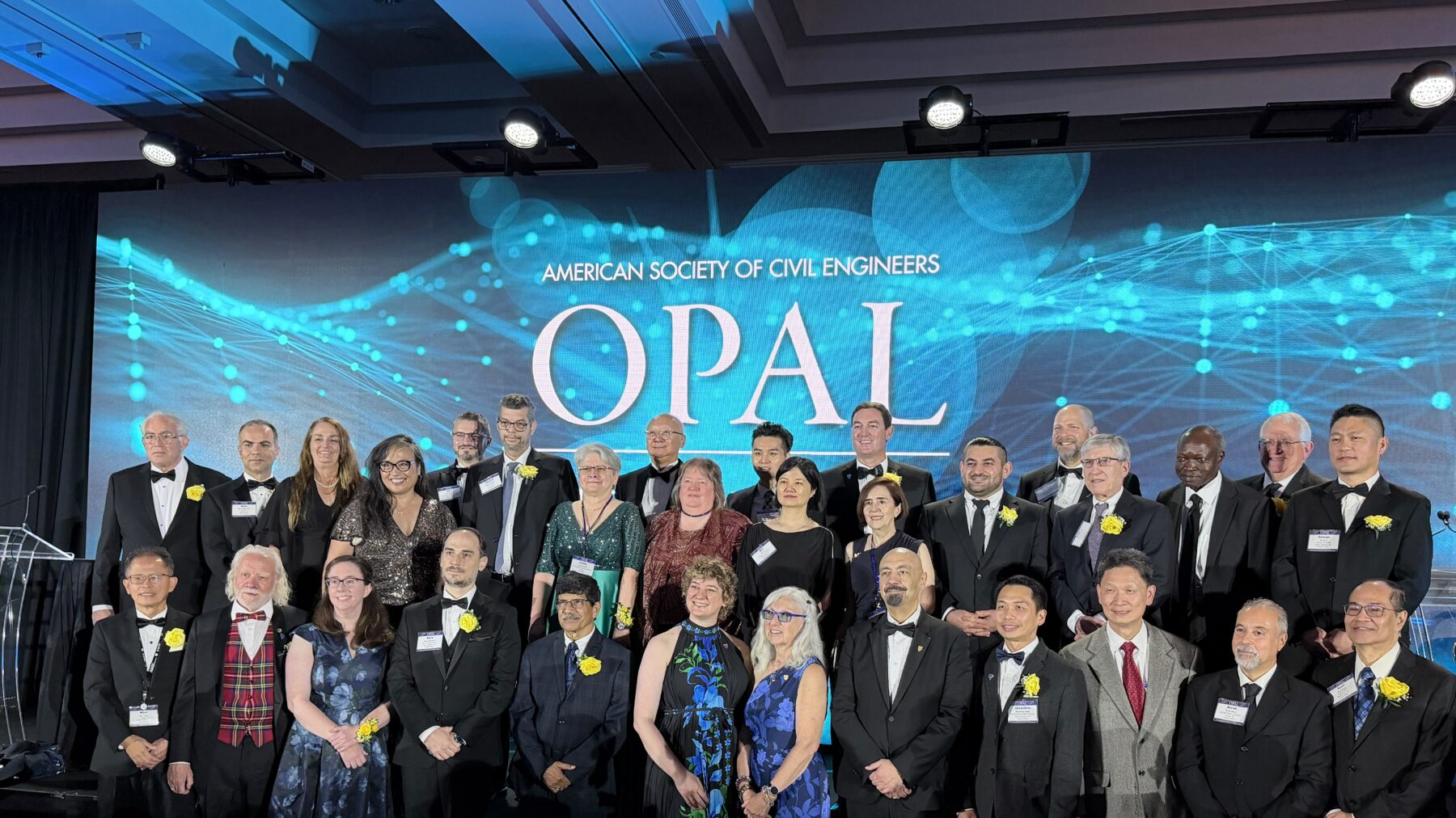 A group of people posed for a group photo for awards